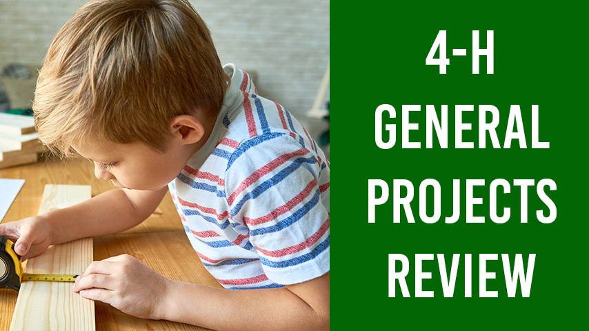 A young boy measures wood with a measuring tape as an example for the 4-H General Projects Review.