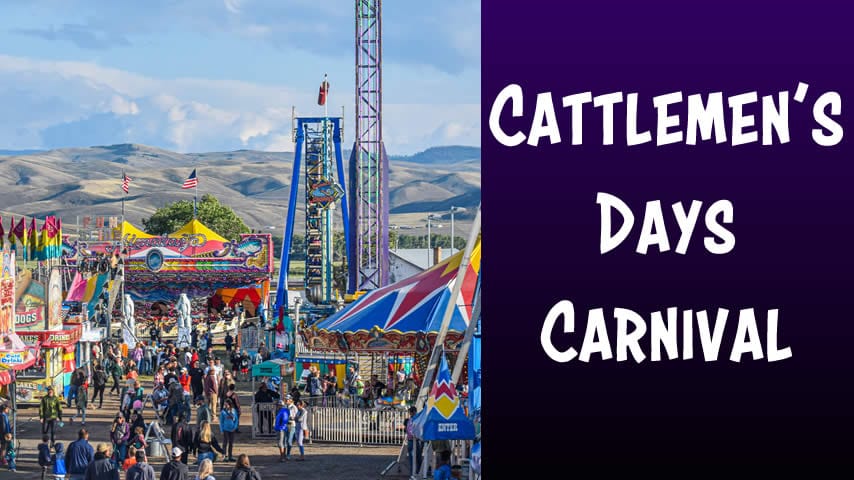 Cattlemens Days carnival venue with colorful rides and crowds of people.